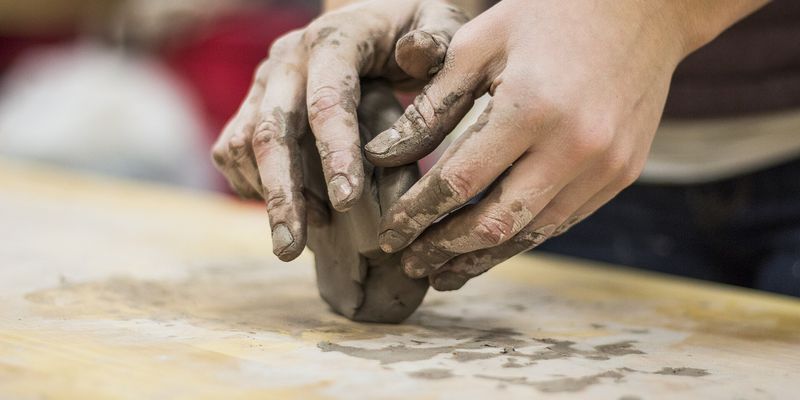 Clay being wedged by hand